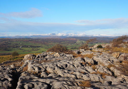 View from Hampsfell summit limestone pavement to Coniston fells