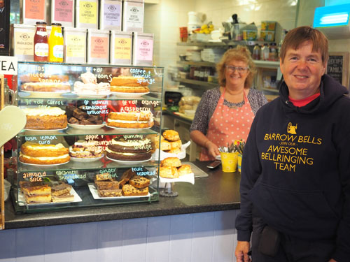 Jo admires cakes in Poppi Red café